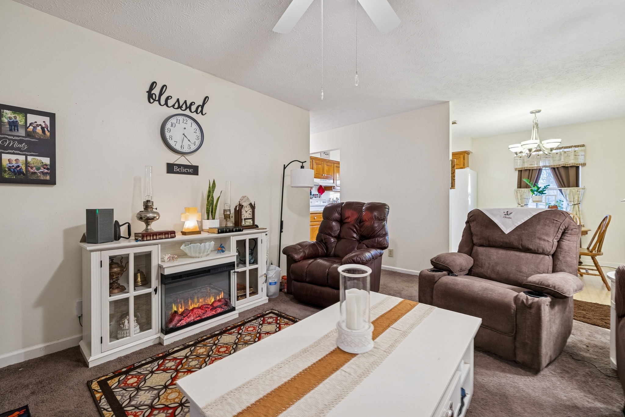 1337 Oaklawn Road Chapmansboro, TN 37035 - Photo 3 of 37 a living room with furniture a rug and a fireplace