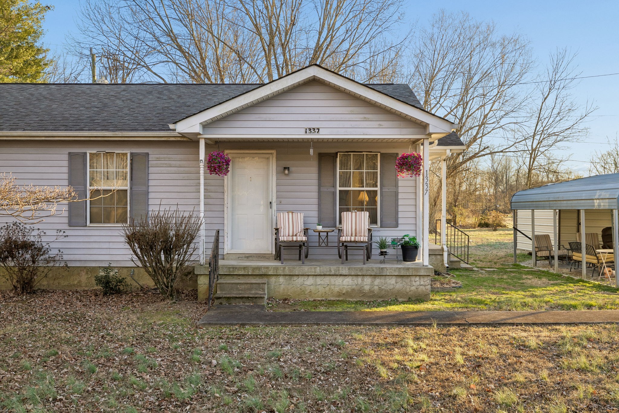 1337 Oaklawn Road Chapmansboro, TN 37035 - Photo 32 of 37 a front view of a house with garden