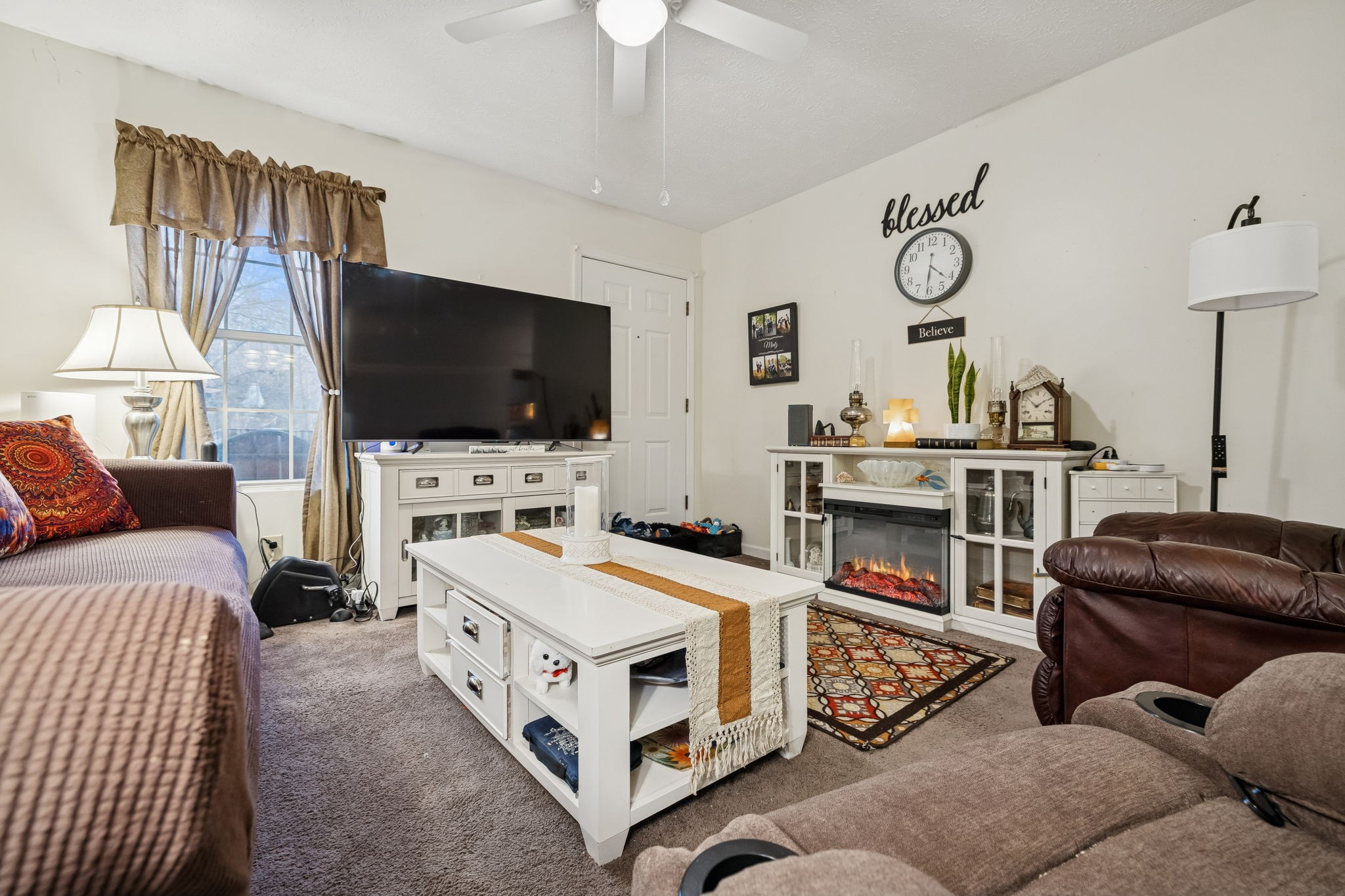 1337 Oaklawn Road Chapmansboro, TN 37035 - Photo 4 of 37 a living room with furniture and a flat screen tv