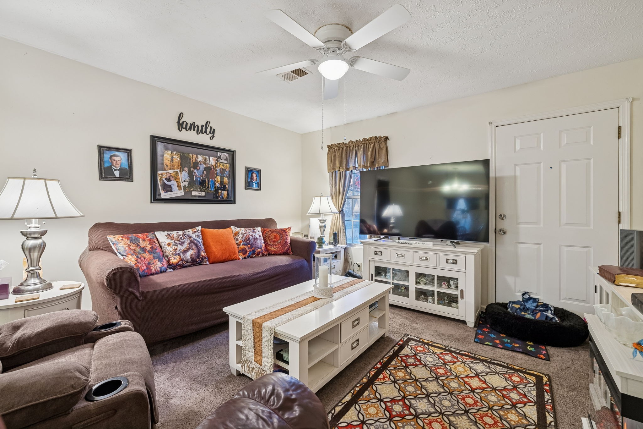 1337 Oaklawn Road Chapmansboro, TN 37035 - Photo 5 of 37 a living room with furniture and a flat screen tv