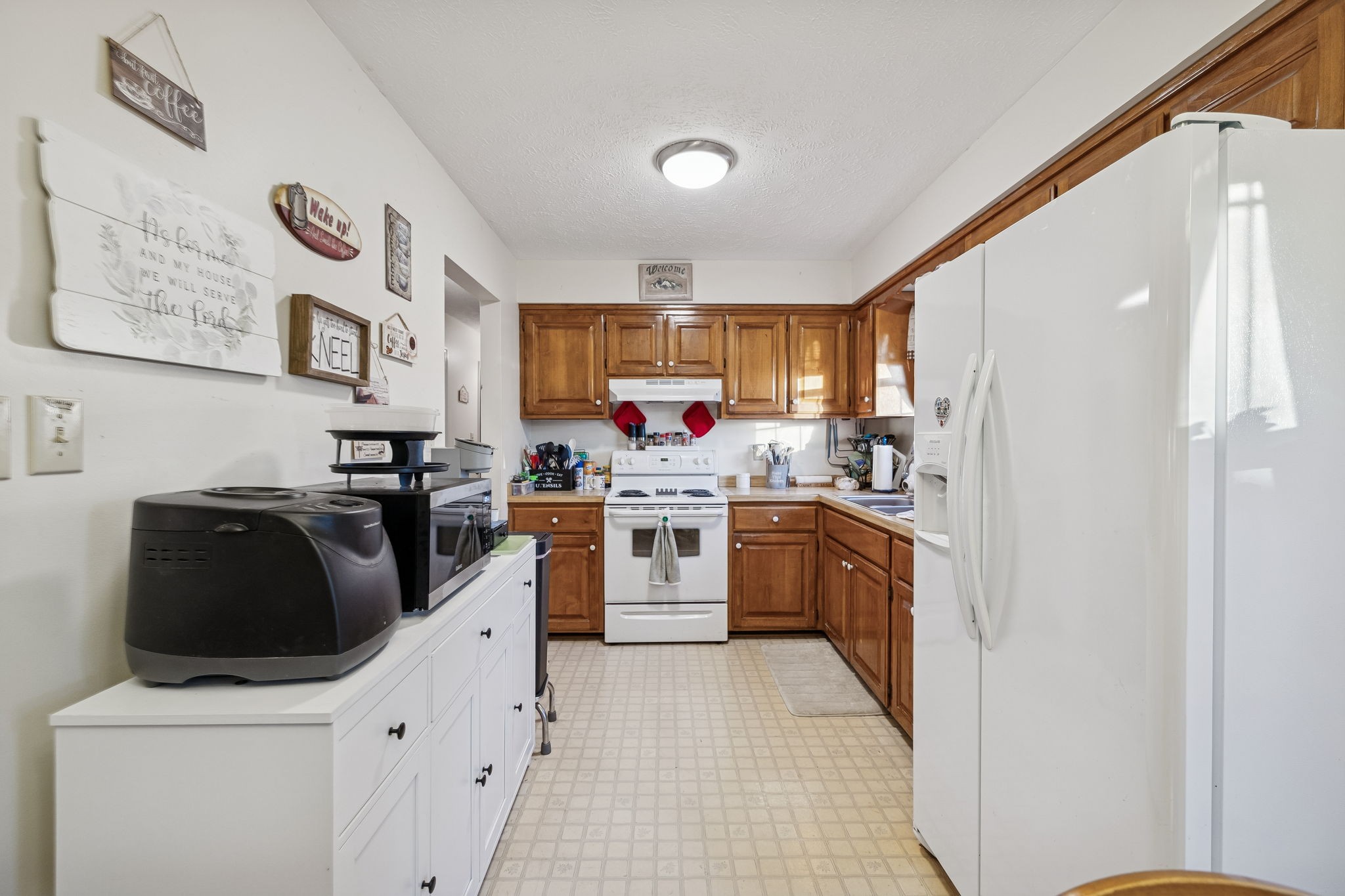 1337 Oaklawn Road Chapmansboro, TN 37035 - Photo 8 of 37 a kitchen with stainless steel appliances a stove a sink and a refrigerator