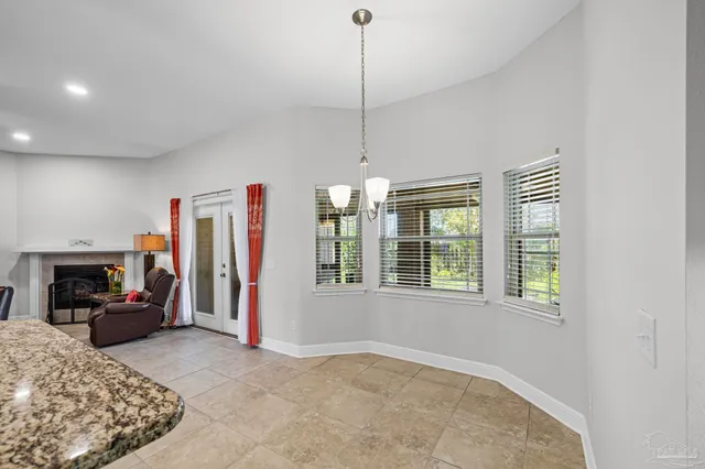 a view of a livingroom with furniture and windows