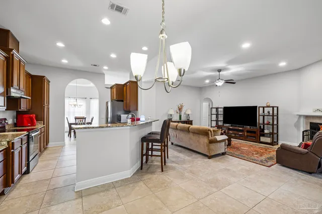 a living room with fireplace furniture and a flat screen tv