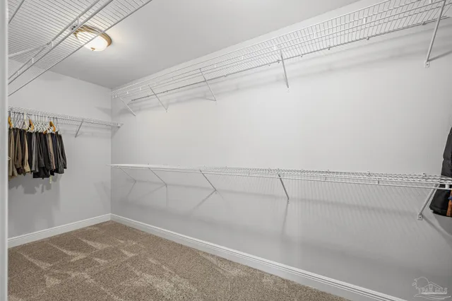 a view of a store room with racks on the wall