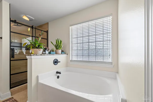 a bathroom with a bathtub and sink