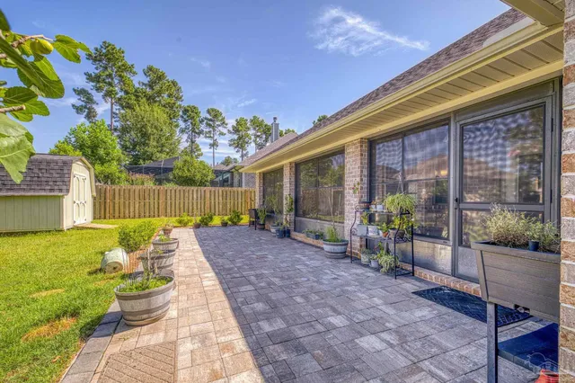a view of a backyard with plants and garden