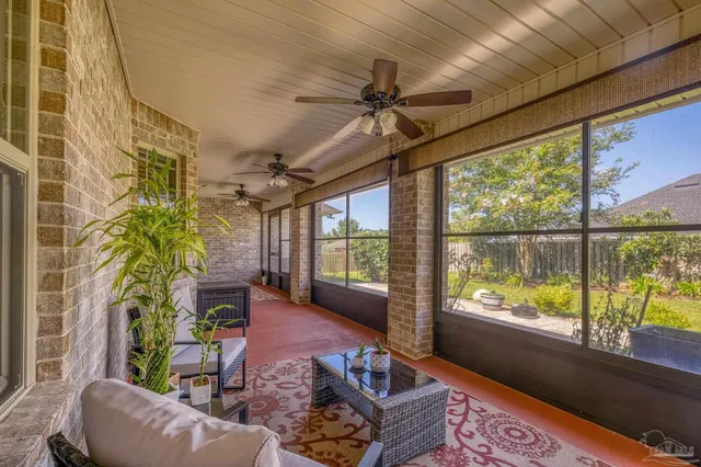 a view of a house with swimming pool and sitting area