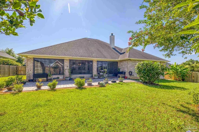 a view of house with yard outdoor seating and entertaining space