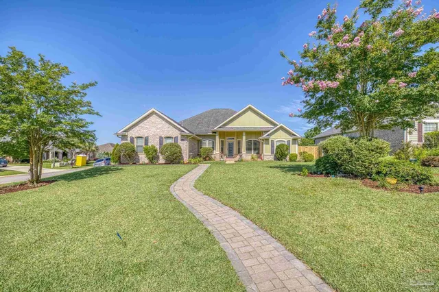 a front view of a house with garden