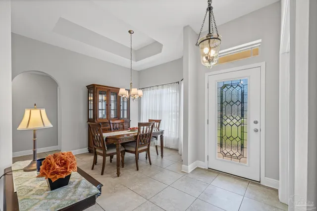 a dining room with furniture and window