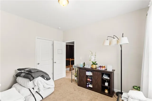 a bedroom with a bed and furniture