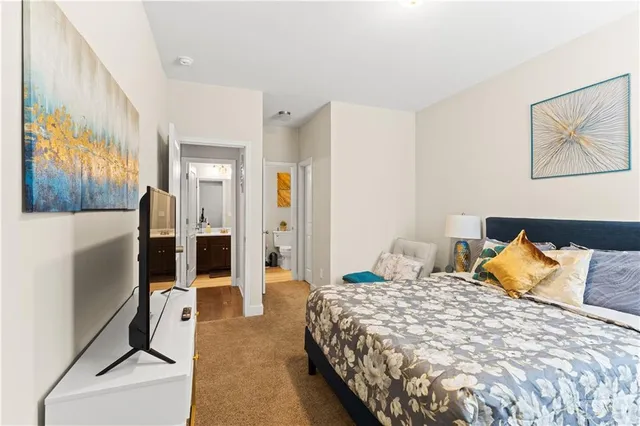 a kitchen that has a sink a stove and cabinets