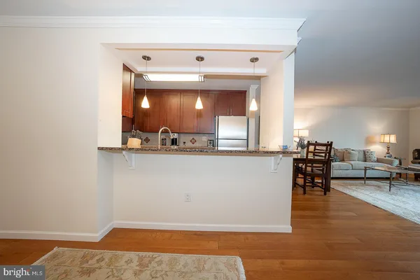 a view of dining room with furniture and chandelier