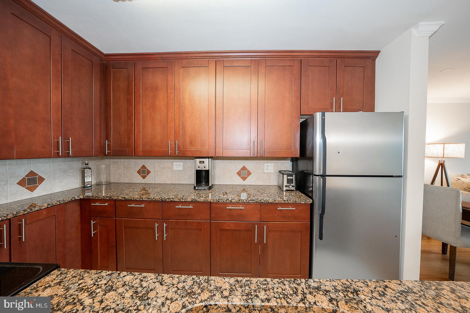1919 Chestnut Street, Unit 2822 Philadelphia, PA 19103 - Photo 14 of 36 a kitchen with stainless steel appliances granite countertop a refrigerator a sink and dishwasher