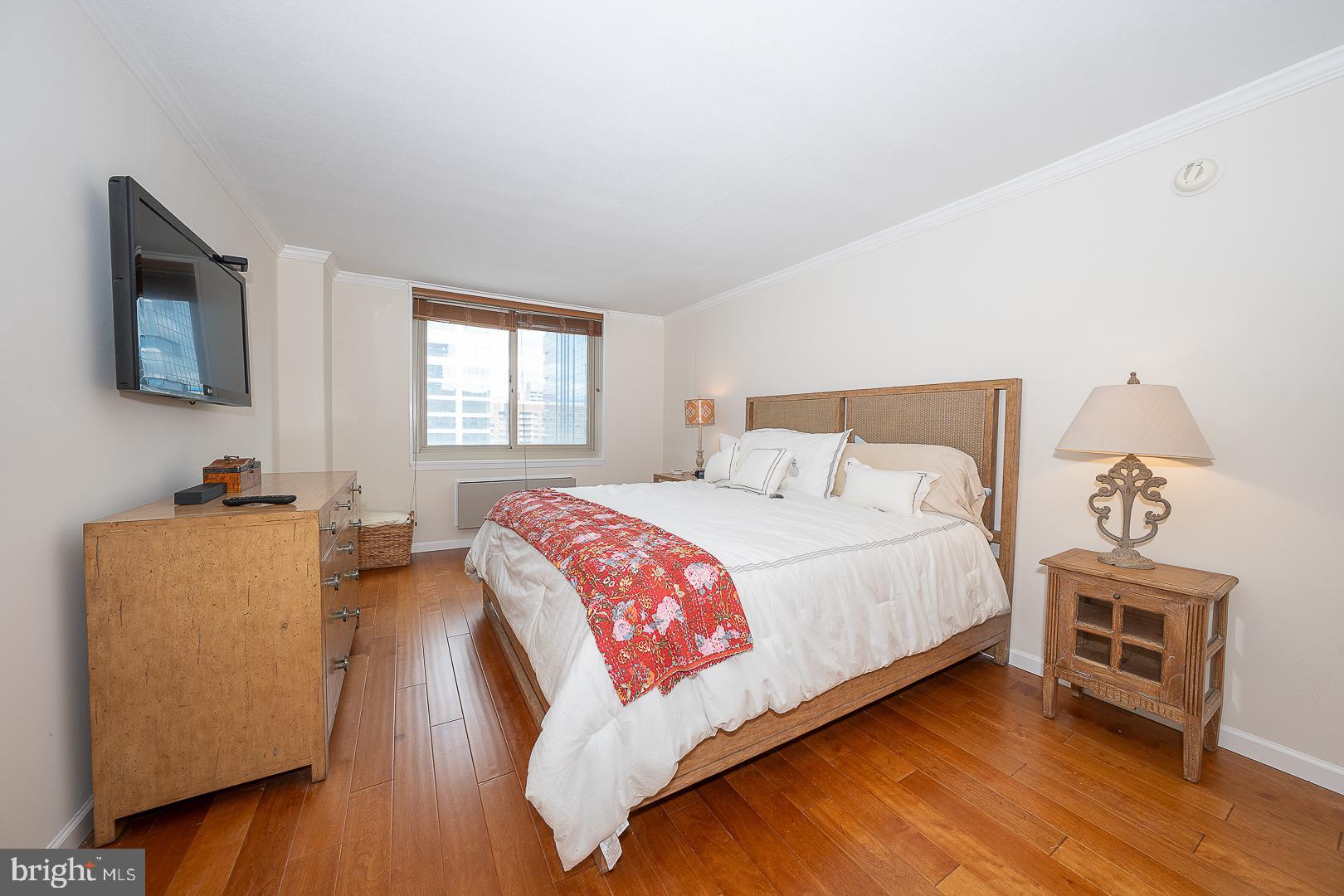 1919 Chestnut Street, Unit 2822 Philadelphia, PA 19103 - Photo 21 of 36 a bedroom with bed and a flat screen tv