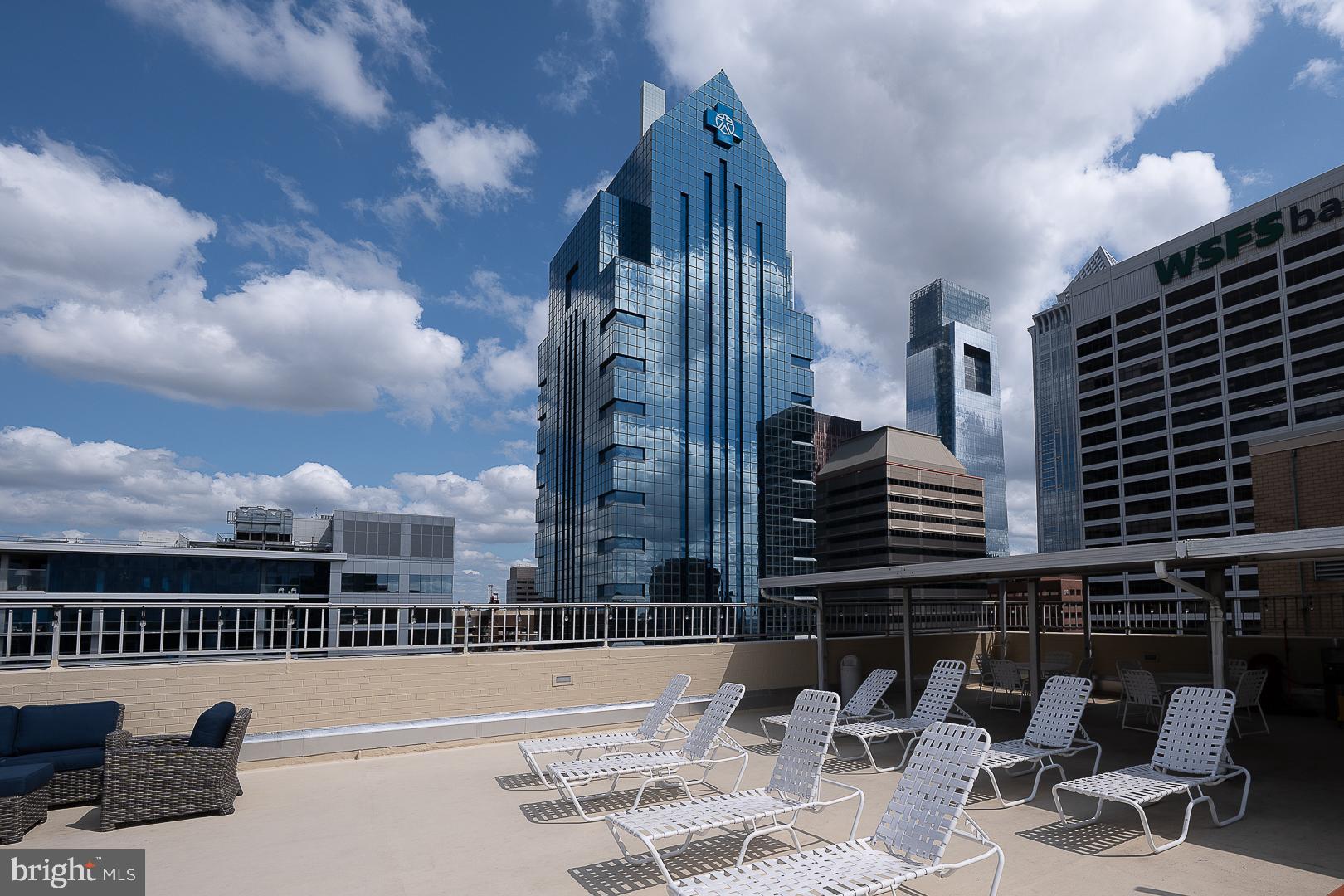 1919 Chestnut Street, Unit 2822 Philadelphia, PA 19103 - Photo 30 of 36 a view of a patio with a table and chairs and potted plants