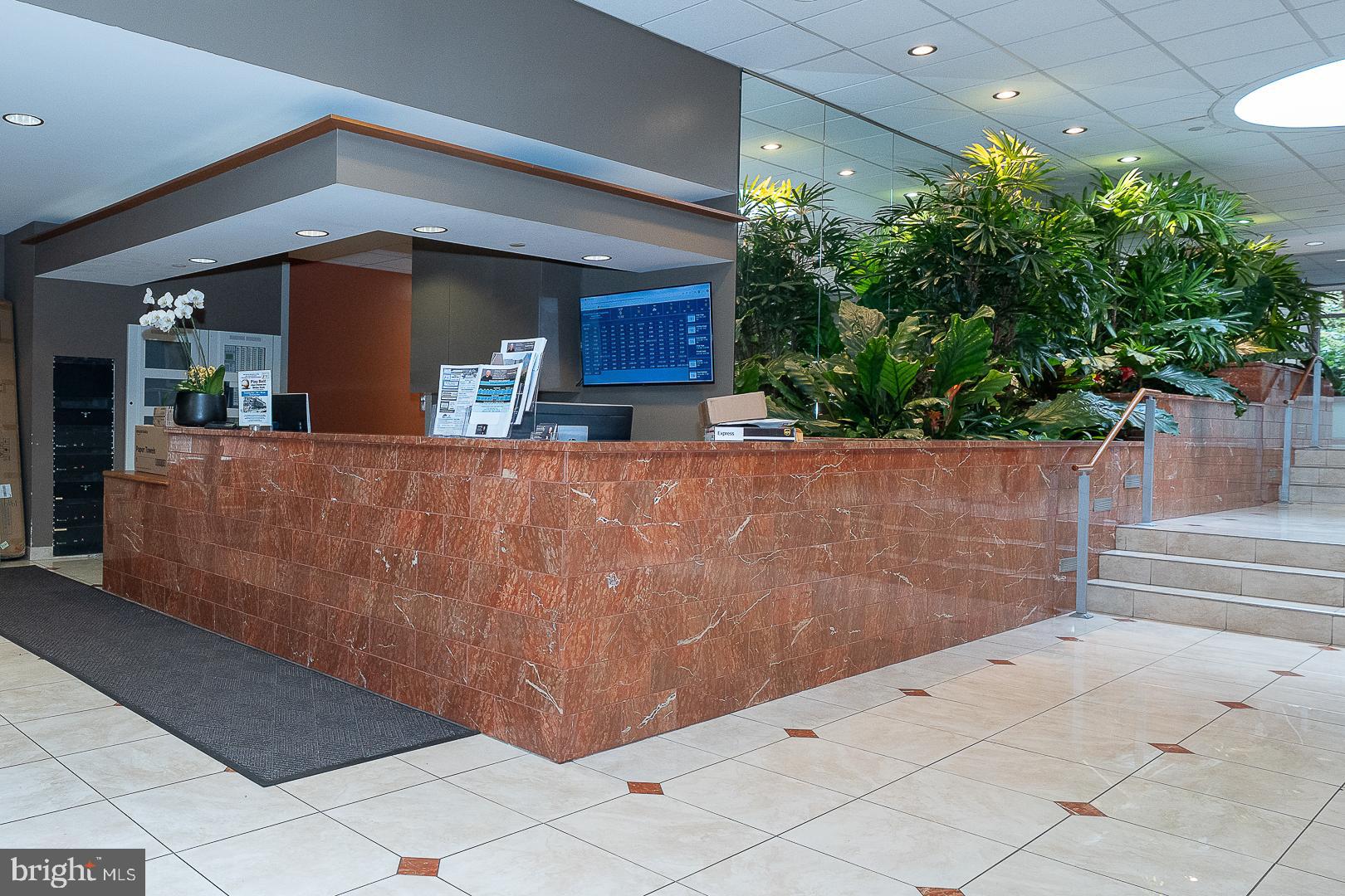 1919 Chestnut Street, Unit 2822 Philadelphia, PA 19103 - Photo 32 of 36 a view of a brick house with potted plants