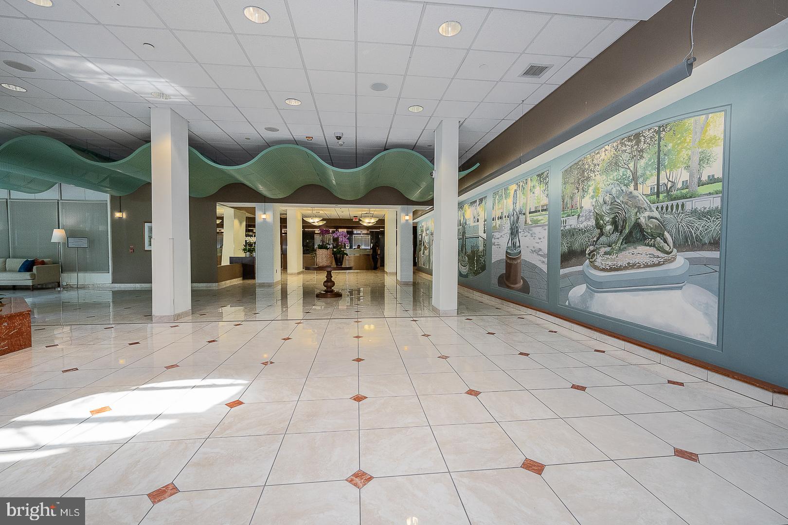 1919 Chestnut Street, Unit 2822 Philadelphia, PA 19103 - Photo 33 of 36 a view of a big room with wooden floor and windows
