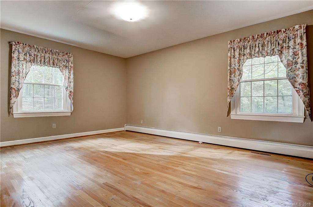 5749 Miller Road Kannapolis, NC 28081 - Photo 22 of 36 an empty room with wooden floor and windows