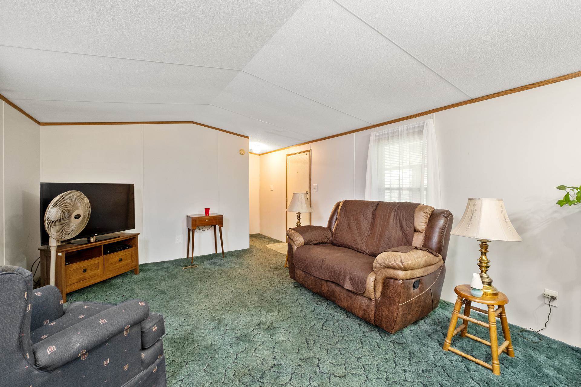 1372 Miller Farm Road Staunton, VA 24401 - Photo 20 of 27 a living room with furniture and a flat screen tv