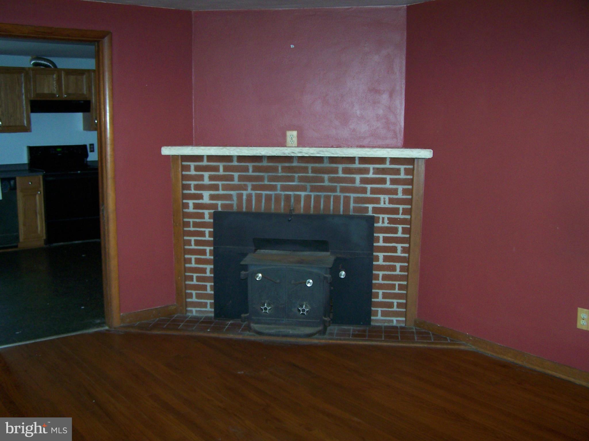 2129 Nicodemus Road Westminster, MD 21157 - Photo 4 of 14 Woodstove insert in living room