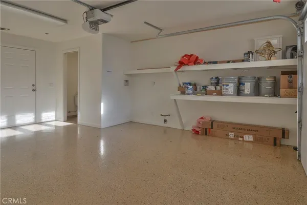 a view of storage and utility room with racks on the wall