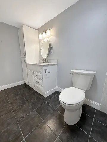 a bathroom with a toilet and a sink