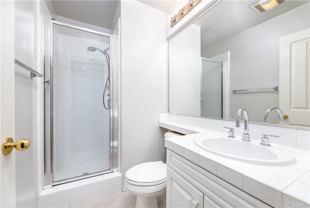 24 Silveroak Irvine, CA 92620 - Photo 11 of 23 a bathroom with a sink toilet and shower