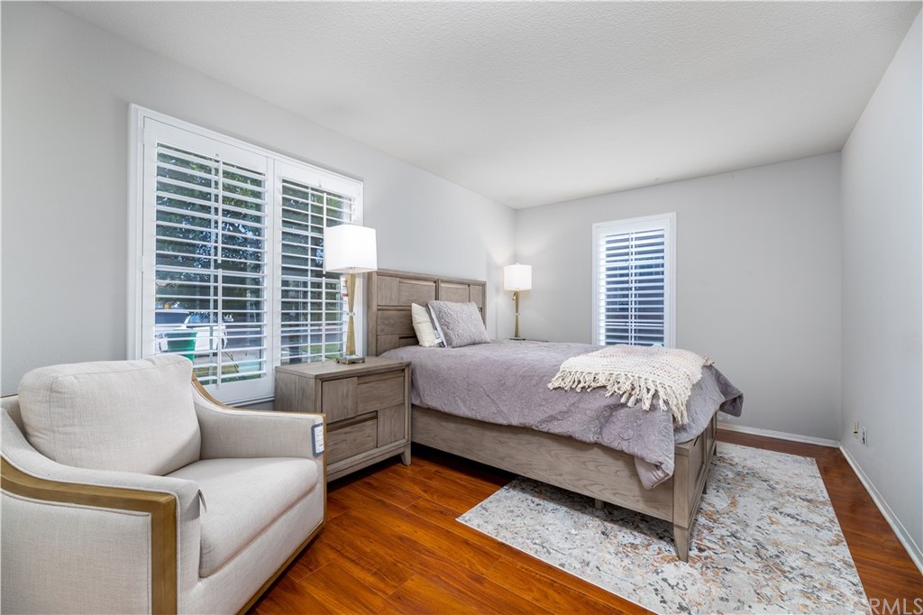 24 Silveroak Irvine, CA 92620 - Photo 13 of 23 a bedroom with a bed and a couch