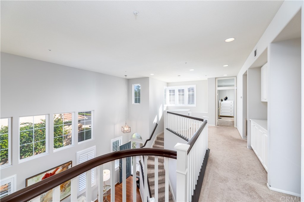 24 Silveroak Irvine, CA 92620 - Photo 14 of 23 a view of a hallway with windows and stairs
