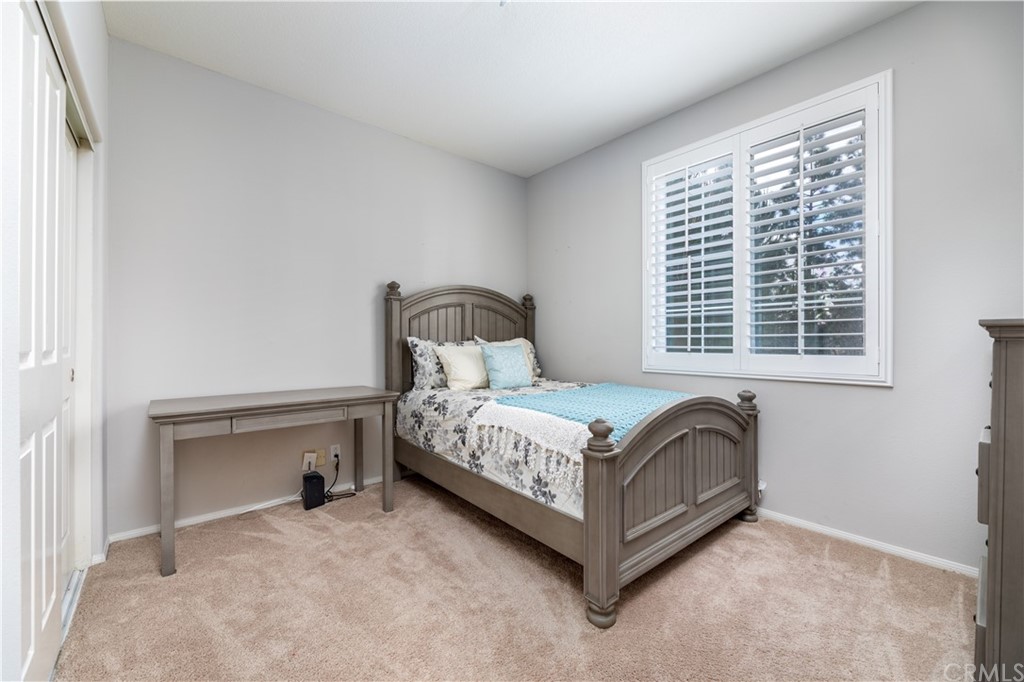 24 Silveroak Irvine, CA 92620 - Photo 15 of 23 a bed sitting in a bedroom next to a window