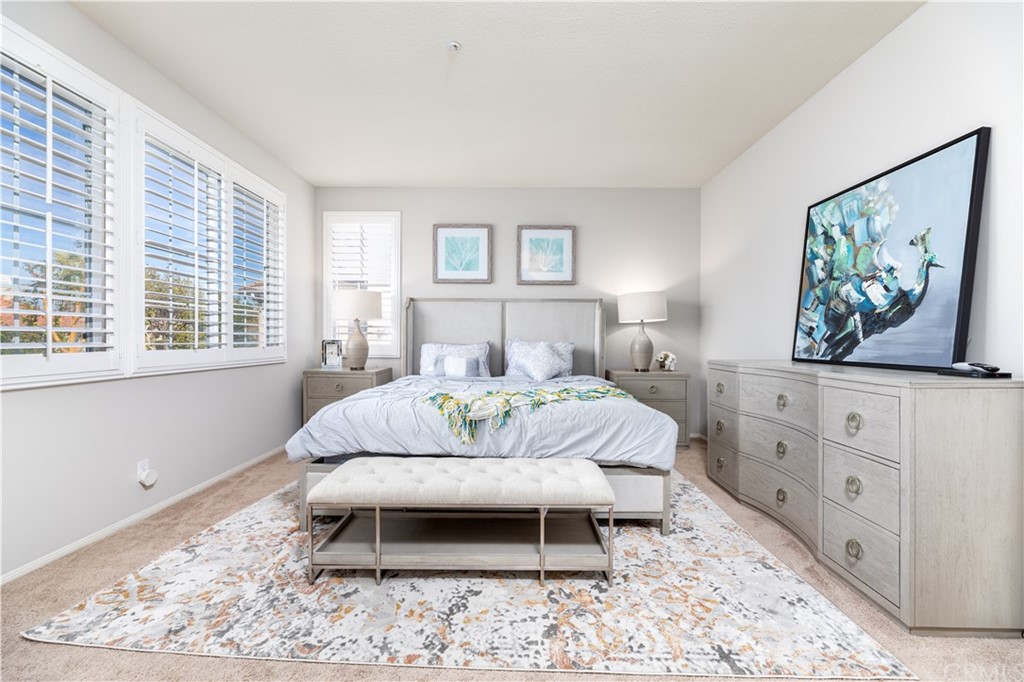 24 Silveroak Irvine, CA 92620 - Photo 18 of 23 a bed room with a bed and a painting on the wall