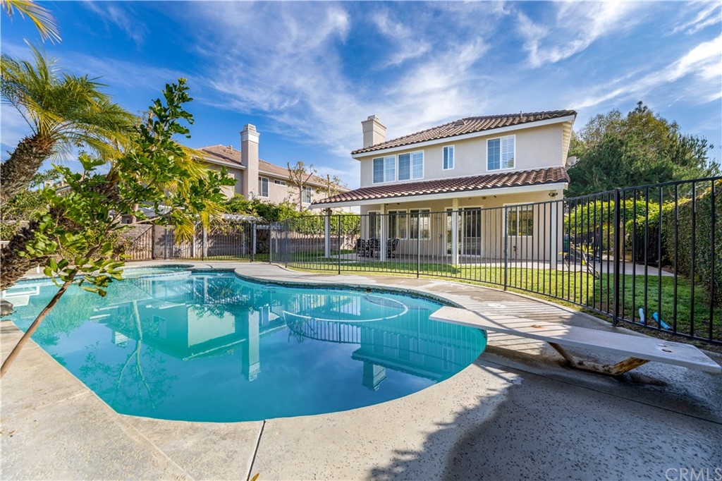 24 Silveroak Irvine, CA 92620 - Photo 22 of 23 a view of a house with swimming pool