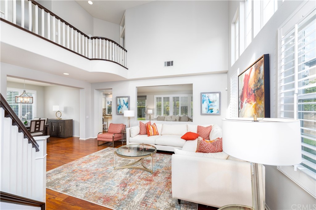 24 Silveroak Irvine, CA 92620 - Photo 4 of 23 a living room with furniture and a flat screen tv