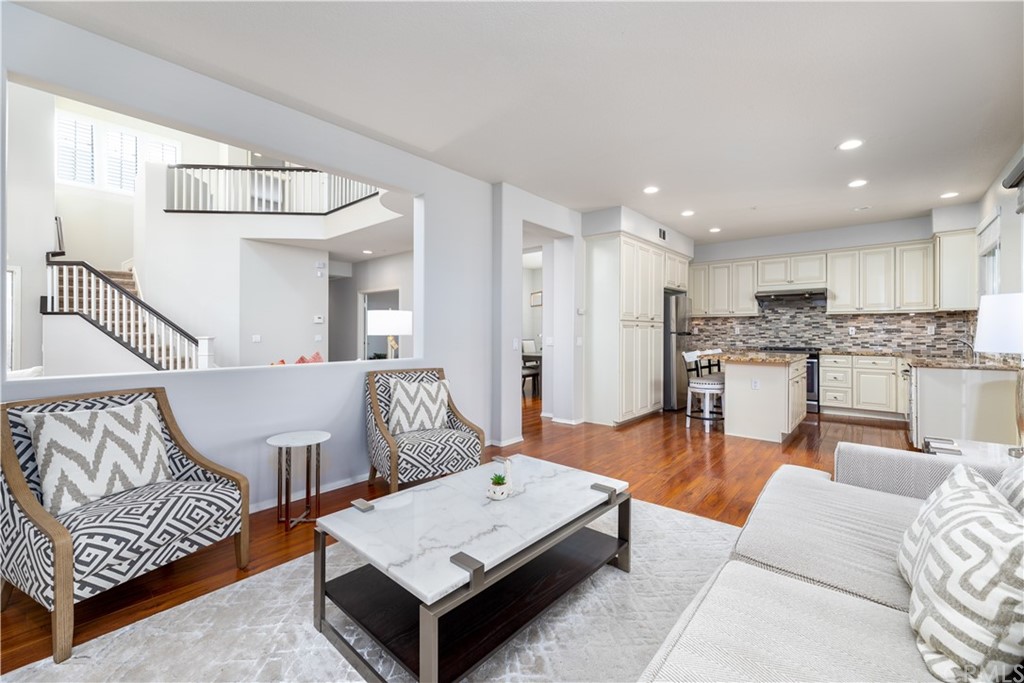 24 Silveroak Irvine, CA 92620 - Photo 8 of 23 a living room with furniture and kitchen view