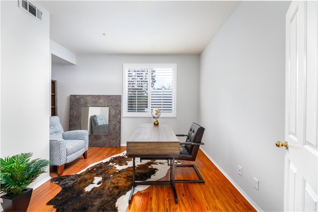 24 Silveroak Irvine, CA 92620 - Photo 10 of 23 a room with furniture and wooden floor