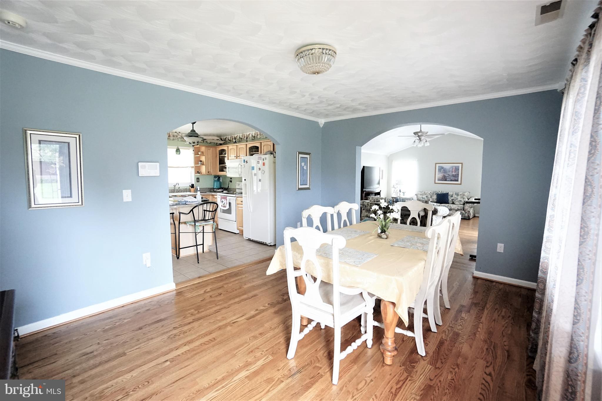 38 Peach Tree Drive Ranson, WV 25438 - Photo 3 of 30 a view of a dining room with furniture and wooden floor