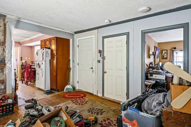 a bedroom with a bed and a mirror