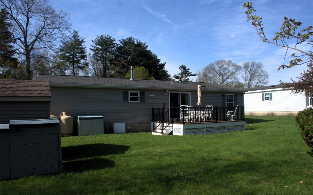 20 Deer Run Brookfield, MA 01506 - Photo 27 of 29 a view of a house with a yard and sitting area