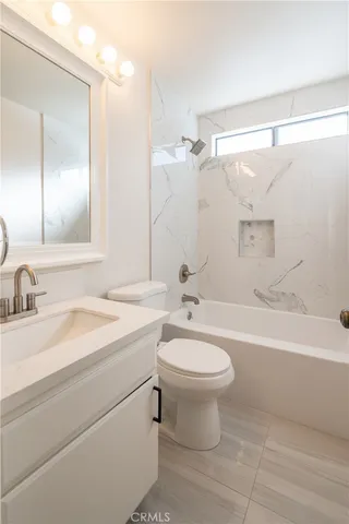 a bathroom with a sink a toilet and a bathtub