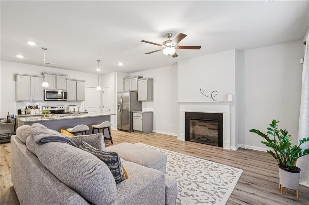 a living room with furniture and a fireplace