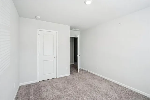 an empty room with closet area