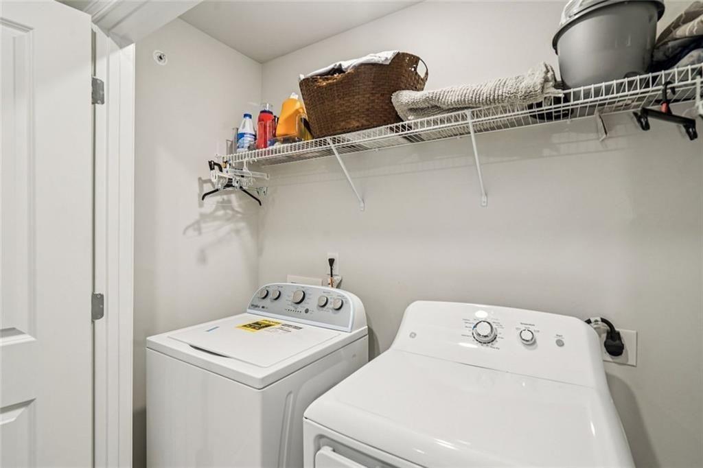 11692 Mendenhall Court Hampton, GA 30228 - Photo 22 of 25 a utility room with dryer and washer