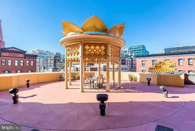 a view of a swimming pool with an outdoor seating