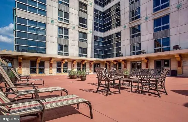 a view of a building with sitting area