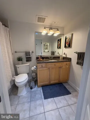 a kitchen with a sink a stove a microwave oven and a dining table