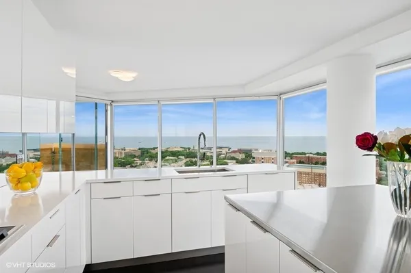 a kitchen with stainless steel appliances granite countertop a sink and cabinets