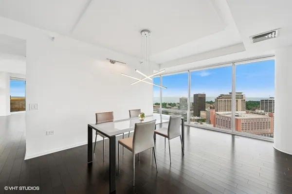 a view of a dining room with furniture window and wooden floor