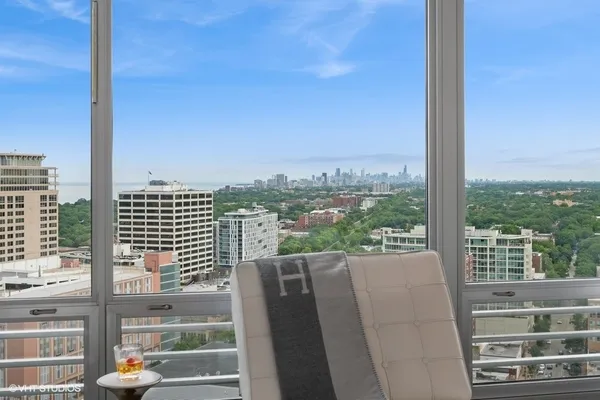 a view of a balcony with city