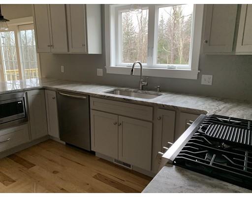Lot 1 Davidson Road Charlton, MA 01507 - Photo 3 of 22 a kitchen with a sink a stove cabinets and a window